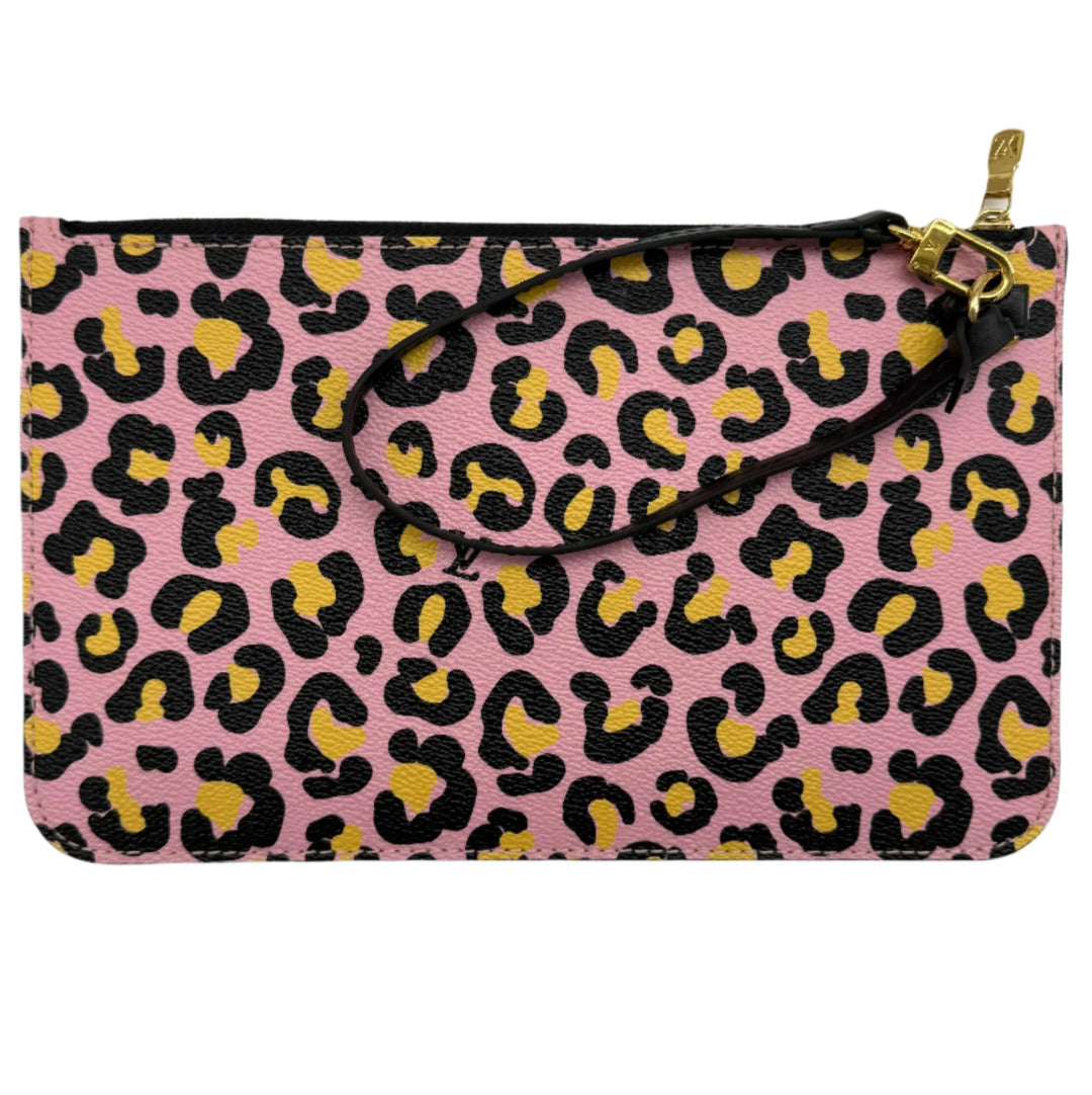 Pink leather clutch featuring leopard print in black and yellow with a wrist strap.